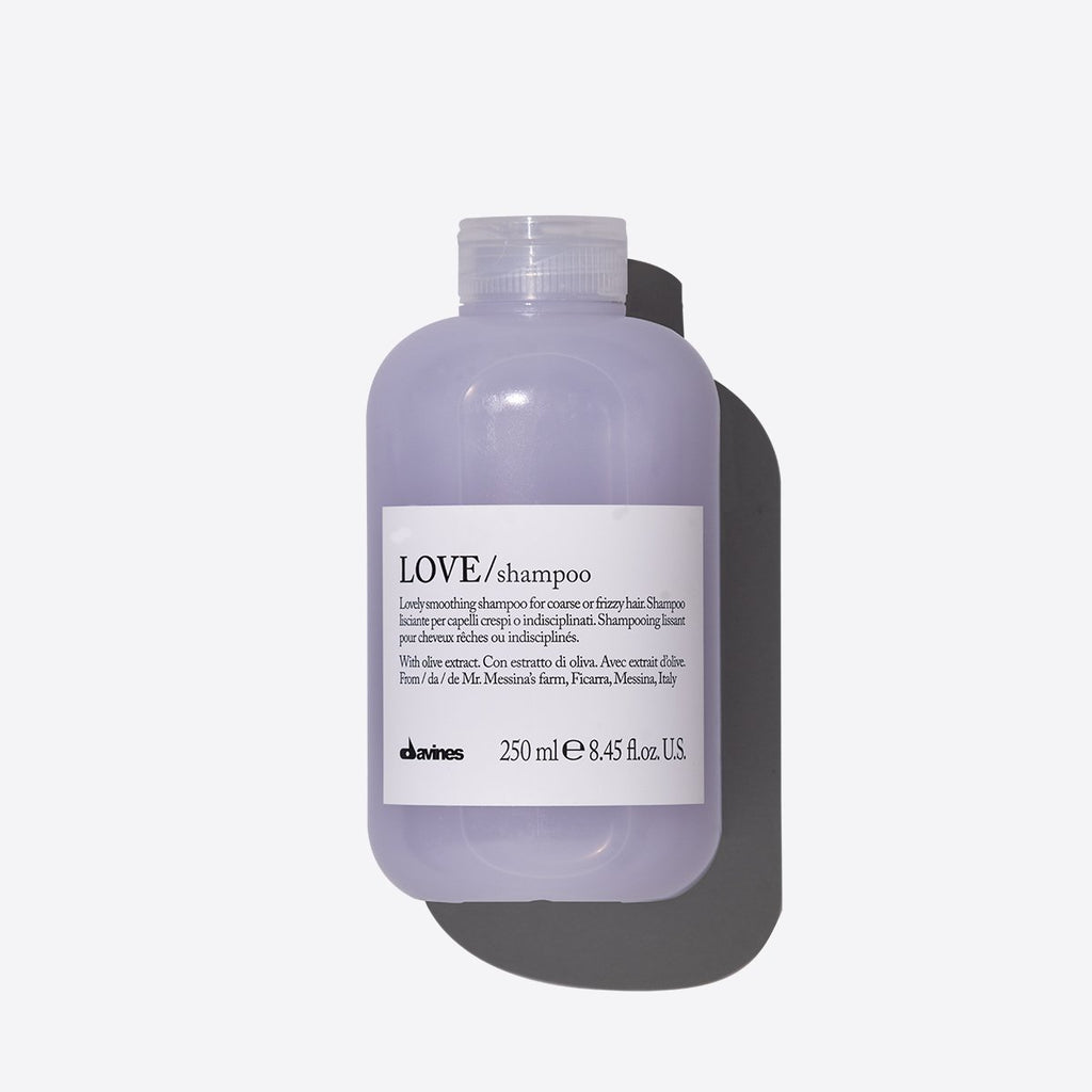 Purple Love smoothing Shampoo in a clear bottle with a white label