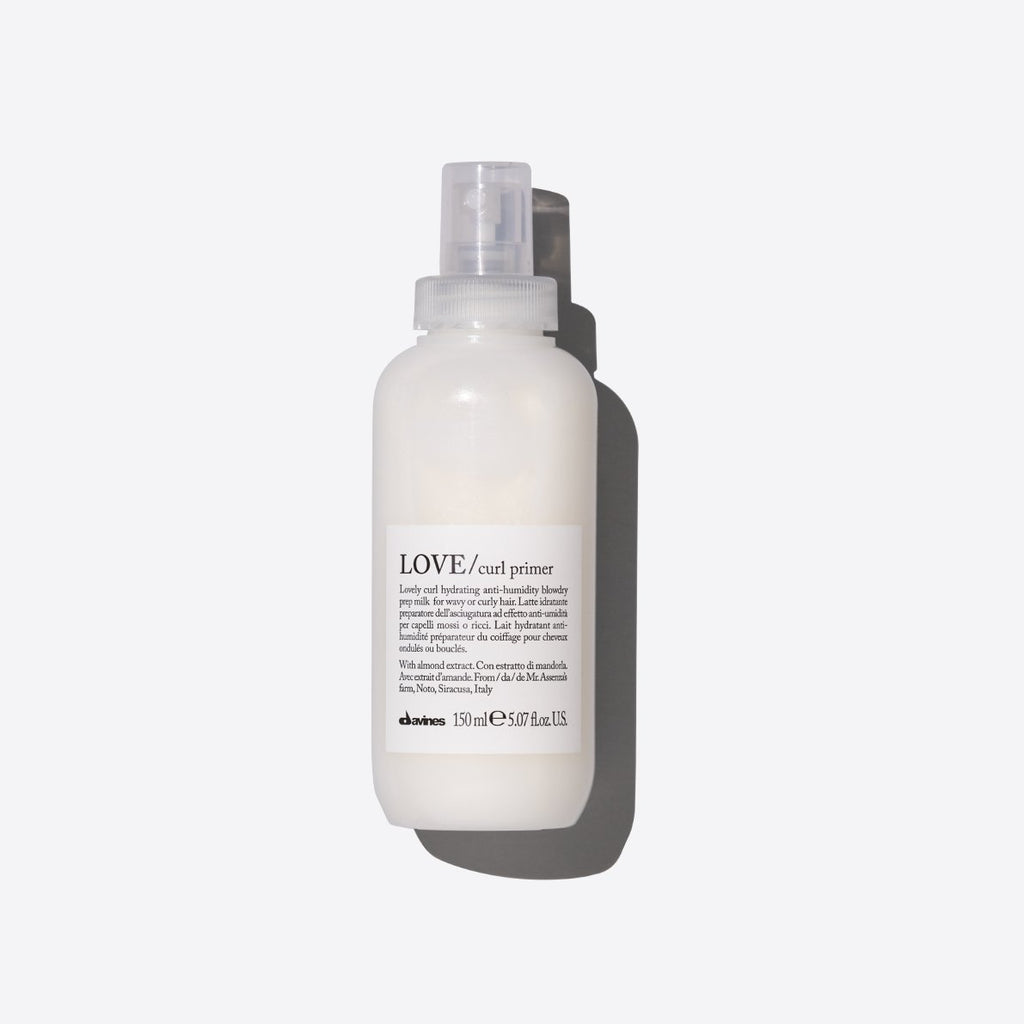 White bottle of curl defining spray 